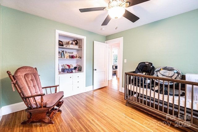 122 15th Ave NW, Hickory, NC 28601 - bedroom with wood-type flooring, a ceiling fan, and an office area