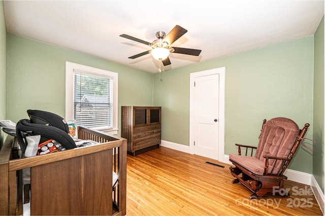 122 15th Ave NW, Hickory, NC 28601 - bedroom with light wood-style floors and ceiling fan