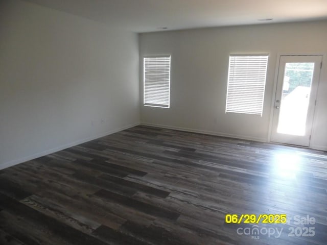 570 30th Avenue Cir NE, Hickory, NC 28601 - spare room with dark wood-type flooring and baseboards
