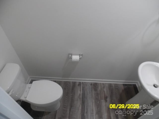 570 30th Avenue Cir NE, Hickory, NC 28601 - half bath with wood finished floors and toilet
