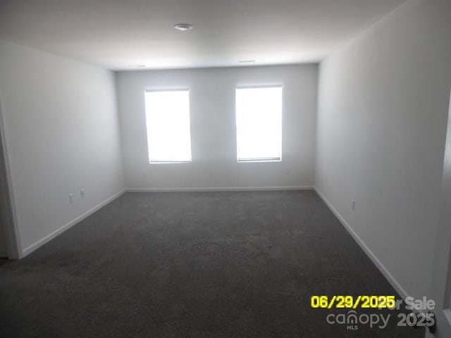 570 30th Avenue Cir NE, Hickory, NC 28601 - empty room with dark colored carpet and baseboards