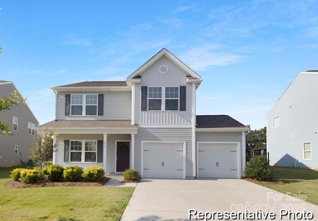 130 Fairfield Dr Unit 20, Troutman, NC 28166 - view of front of property featuring driveway, board and batten siding, a front lawn, and an attached garage