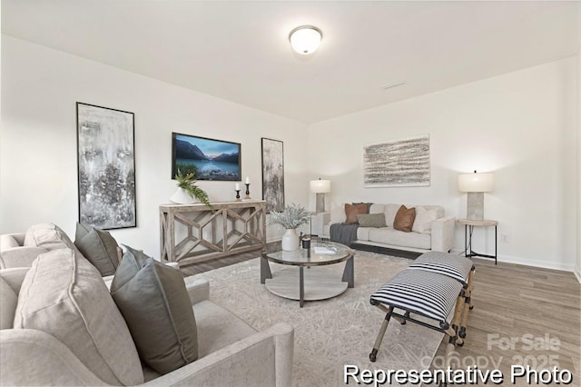 130 Fairfield Dr Unit 20, Troutman, NC 28166 - living area featuring wood finished floors and baseboards