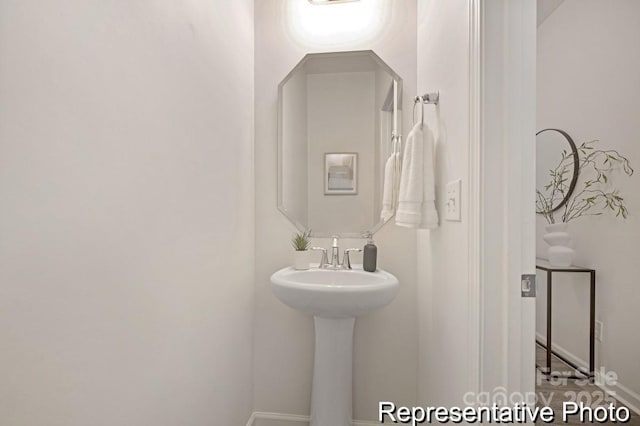 130 Fairfield Dr Unit 20, Troutman, NC 28166 - bathroom featuring baseboards and a sink