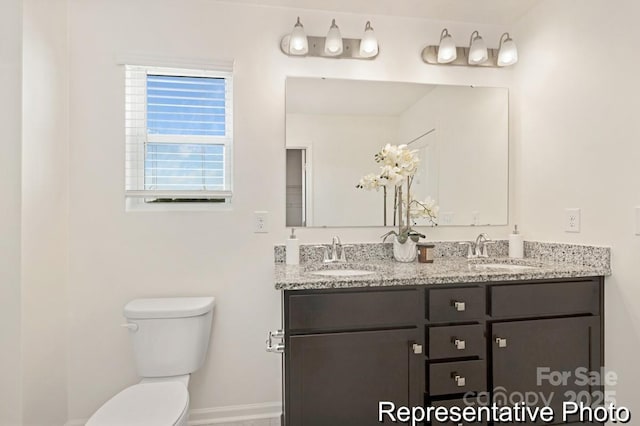 130 Fairfield Dr Unit 20, Troutman, NC 28166 - bathroom with double vanity and toilet