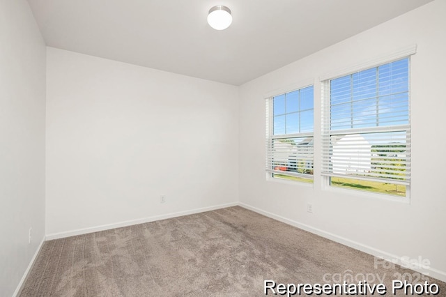 130 Fairfield Dr Unit 20, Troutman, NC 28166 - empty room featuring baseboards and carpet
