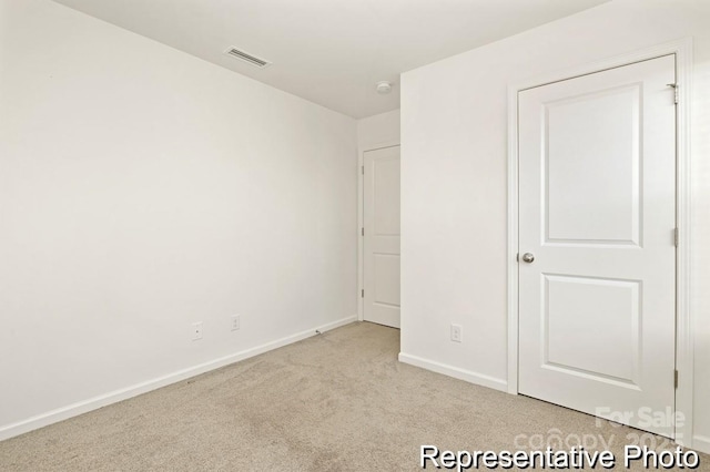 130 Fairfield Dr Unit 20, Troutman, NC 28166 - unfurnished bedroom featuring carpet floors and baseboards