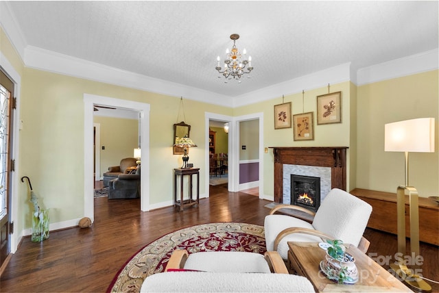 262 8th Ave, Cramerton, NC 28032 - living area featuring wood finished floors, a chandelier, a warm lit fireplace, and crown molding
