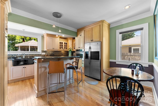 262 8th Ave, Cramerton, NC 28032 - kitchen with appliances with stainless steel finishes, glass insert cabinets, plenty of natural light, a center island, and crown molding