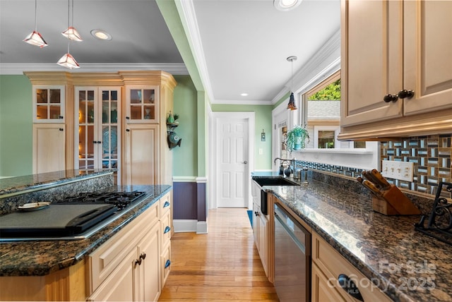 262 8th Ave, Cramerton, NC 28032 - kitchen with light wood-style flooring, ornamental molding, stainless steel appliances, pendant lighting, and dark stone countertops