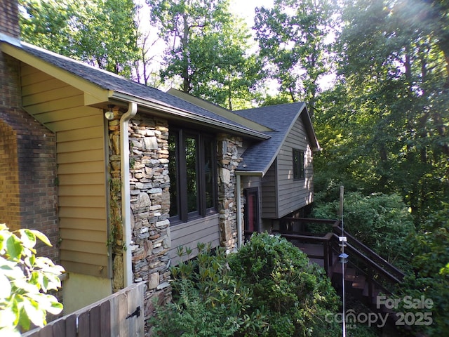 140 Beechwood Cir, Hendersonville, NC 28739 - view of side of property with a shingled roof and stone siding