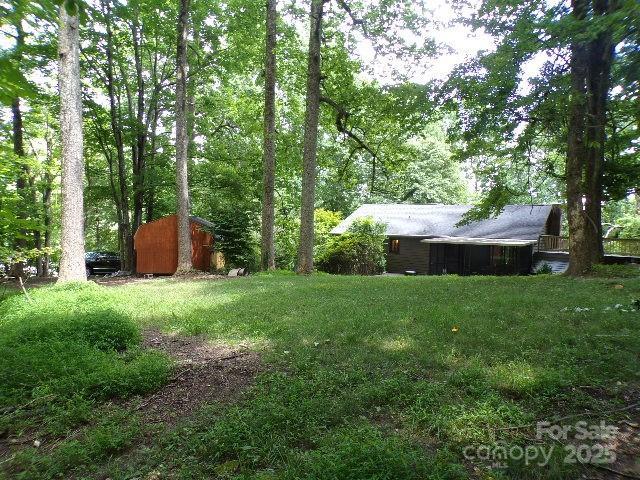 140 Beechwood Cir, Hendersonville, NC 28739 - view of green lawn featuring a shed