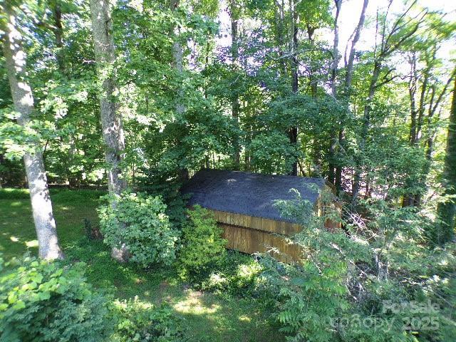 140 Beechwood Cir, Hendersonville, NC 28739 - view of grassy yard featuring a forest view