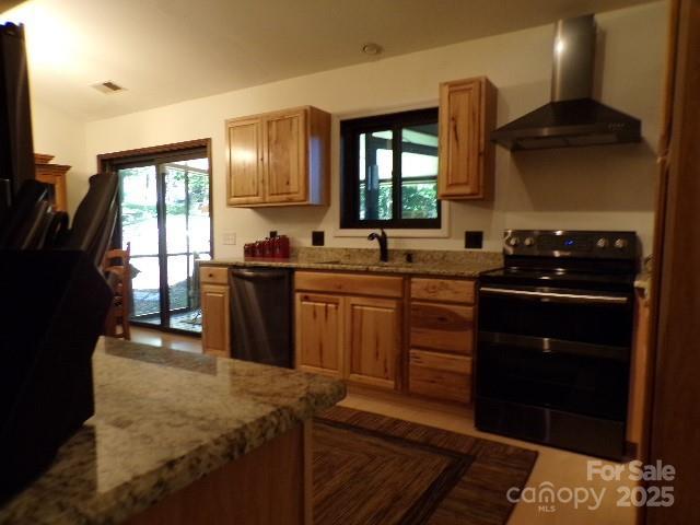 140 Beechwood Cir, Hendersonville, NC 28739 - kitchen featuring black range with electric stovetop, wall chimney exhaust hood, dishwasher, and light stone countertops