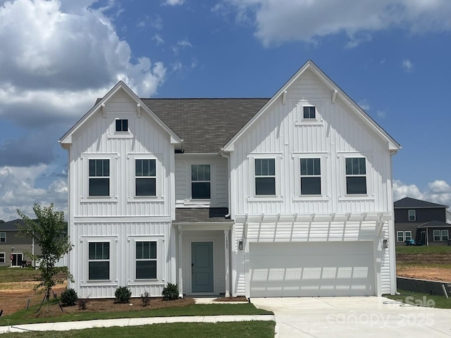 1005 Lorrie Ln Unit 84, Albemarle, NC 28001 - modern inspired farmhouse featuring board and batten siding, roof with shingles, and driveway