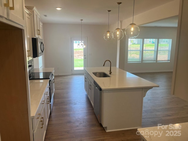 1005 Lorrie Ln Unit 84, Albemarle, NC 28001 - kitchen featuring dark wood finished floors, appliances with stainless steel finishes, light countertops, an island with sink, and recessed lighting