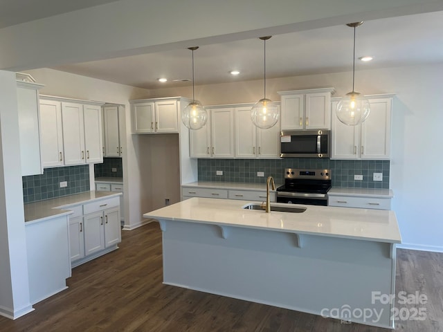 1005 Lorrie Ln Unit 84, Albemarle, NC 28001 - kitchen featuring stainless steel appliances, backsplash, dark wood-style flooring, white cabinetry, and recessed lighting