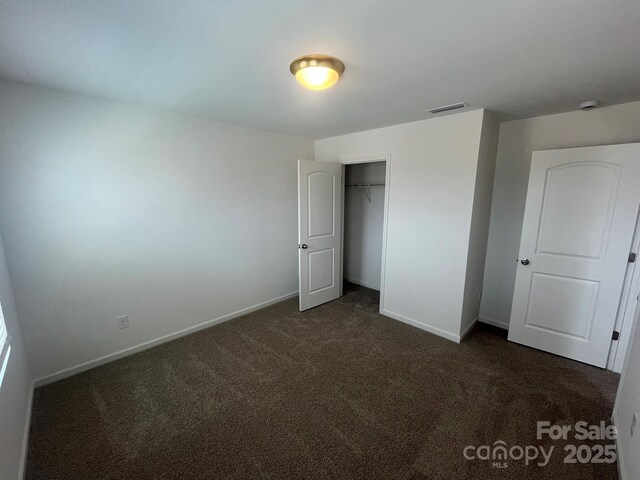 1005 Lorrie Ln Unit 84, Albemarle, NC 28001 - unfurnished bedroom with dark colored carpet and a closet