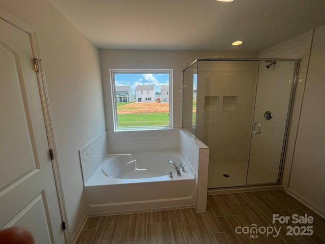 1005 Lorrie Ln Unit 84, Albemarle, NC 28001 - bathroom with a bath, a stall shower, wood finish floors, and recessed lighting