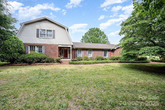 4630 Woodleaf Rd, Salisbury, NC 28147 - dutch colonial featuring a gambrel roof, brick siding, and a front lawn