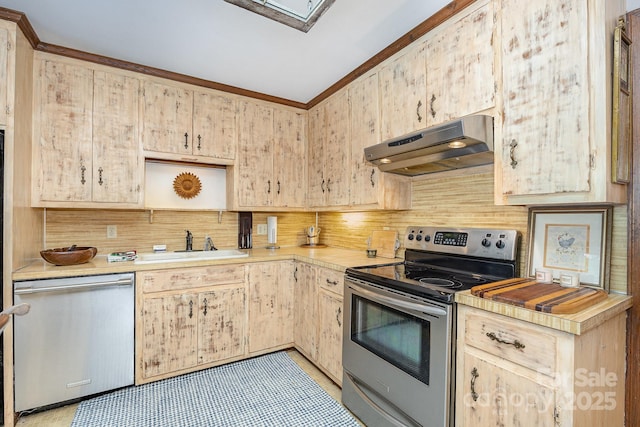 4630 Woodleaf Rd, Salisbury, NC 28147 - kitchen with stainless steel appliances, under cabinet range hood, backsplash, light countertops, and ornamental molding