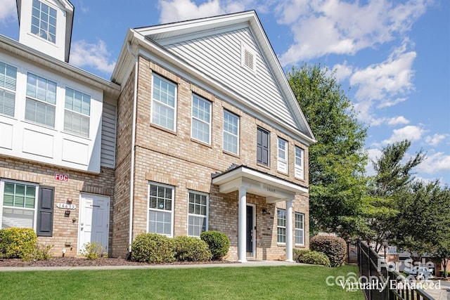14643 Juventus St, Charlotte, NC 28277 - view of front of house with a front yard and brick siding
