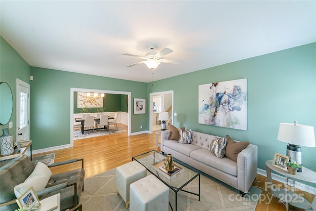 8509 Castle Cliff Dr, Matthews, NC 28105 - living area featuring light wood-style flooring and a ceiling fan