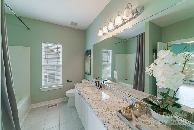 8509 Castle Cliff Dr, Matthews, NC 28105 - full bathroom featuring shower / bath combo with shower curtain, tile patterned floors, and double vanity