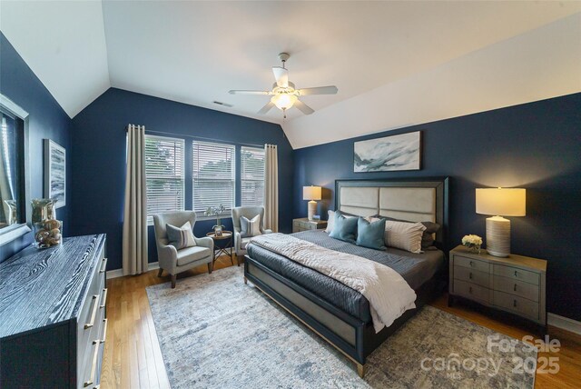 8509 Castle Cliff Dr, Matthews, NC 28105 - bedroom featuring vaulted ceiling, wood finished floors, and ceiling fan