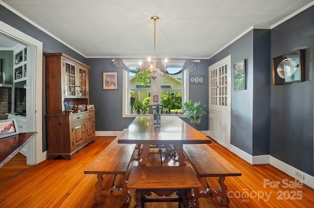 22 Poplar St, Belmont, NC 28012 - dining area featuring a chandelier, ornamental molding, and light wood-style floors