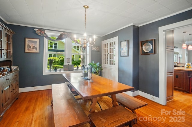 22 Poplar St, Belmont, NC 28012 - dining space featuring crown molding, a chandelier, and light wood-style floors