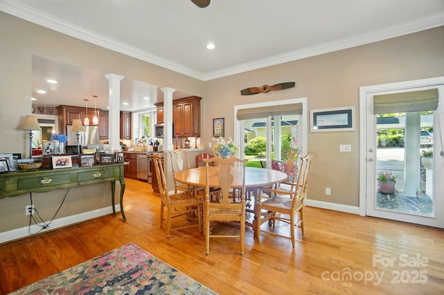 22 Poplar St, Belmont, NC 28012 - dining space featuring light wood finished floors, plenty of natural light, decorative columns, ornamental molding, and recessed lighting