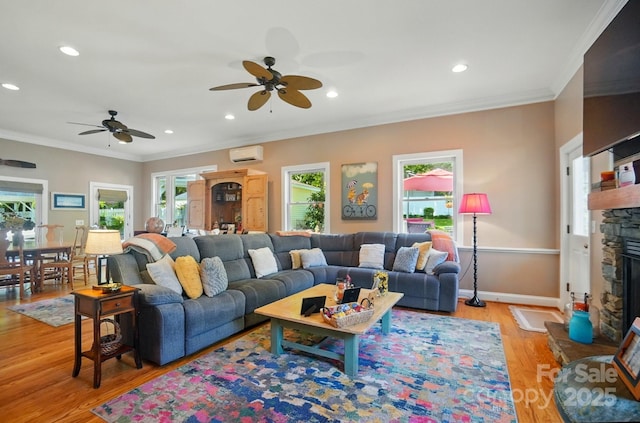 22 Poplar St, Belmont, NC 28012 - living area with a ceiling fan, light wood-type flooring, a stone fireplace, ornamental molding, and recessed lighting