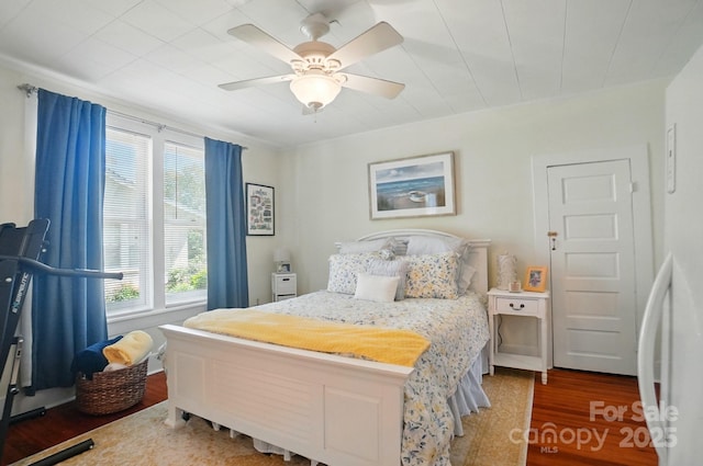 22 Poplar St, Belmont, NC 28012 - bedroom with wood finished floors, freestanding refrigerator, and a ceiling fan