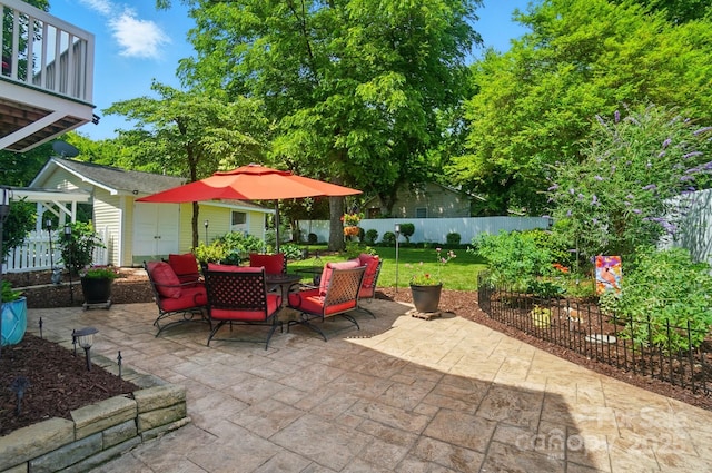 22 Poplar St, Belmont, NC 28012 - view of patio / terrace with outdoor dining area and a shed