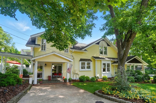 22 Poplar St, Belmont, NC 28012 - view of front of house featuring a porch, a balcony, and a shingled roof