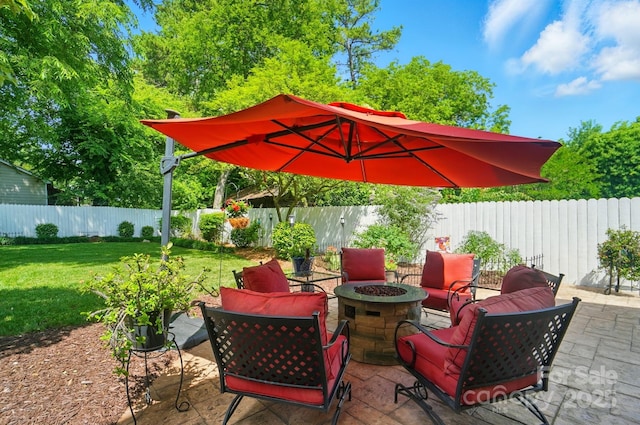 22 Poplar St, Belmont, NC 28012 - fenced backyard with an outdoor fire pit and a patio