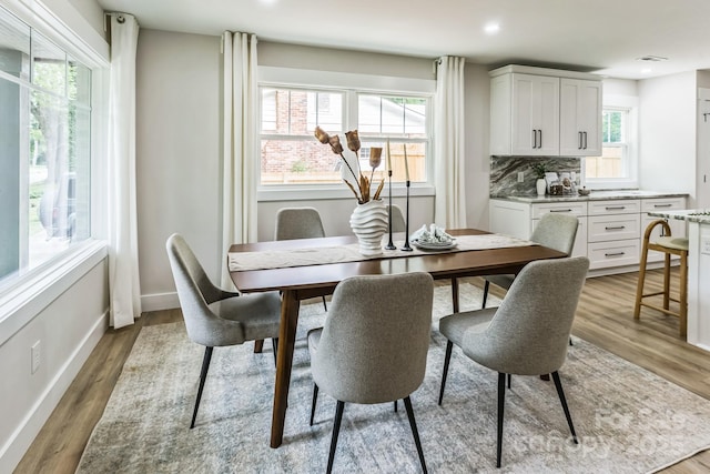 1208 Tarrington Ave, Charlotte, NC 28205 - dining space featuring healthy amount of natural light, light wood finished floors, and recessed lighting