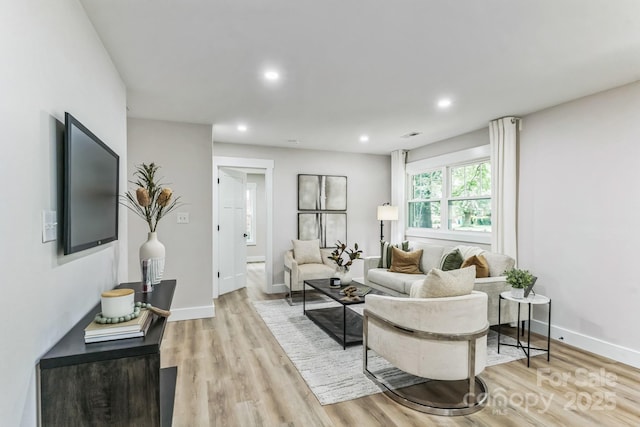 1208 Tarrington Ave, Charlotte, NC 28205 - living room with light wood finished floors and recessed lighting
