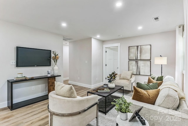 1208 Tarrington Ave, Charlotte, NC 28205 - living room with light wood-style floors and recessed lighting