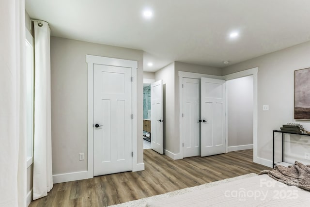 1208 Tarrington Ave, Charlotte, NC 28205 - unfurnished bedroom with wood finished floors and recessed lighting