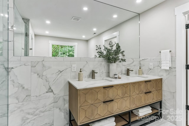 1208 Tarrington Ave, Charlotte, NC 28205 - full bathroom with double vanity, recessed lighting, and tile walls