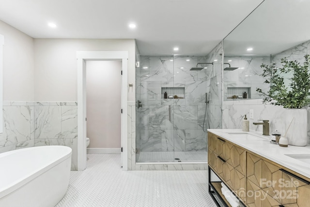 1208 Tarrington Ave, Charlotte, NC 28205 - bathroom with tile walls, a marble finish shower, a soaking tub, recessed lighting, and double vanity