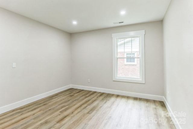 1208 Tarrington Ave, Charlotte, NC 28205 - empty room featuring light wood-style floors and recessed lighting