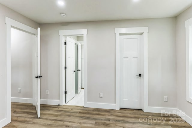 1208 Tarrington Ave, Charlotte, NC 28205 - unfurnished bedroom with wood finished floors and connected bathroom