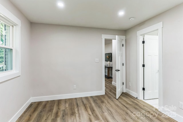 1208 Tarrington Ave, Charlotte, NC 28205 - unfurnished bedroom featuring wood finished floors and recessed lighting