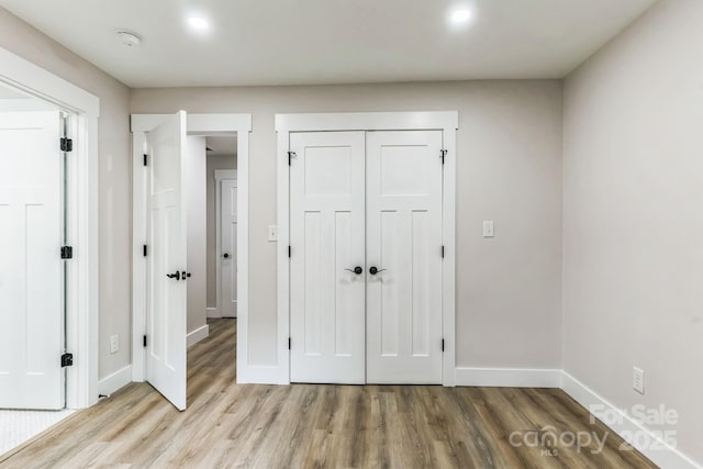 1208 Tarrington Ave, Charlotte, NC 28205 - unfurnished bedroom featuring wood finished floors and a closet