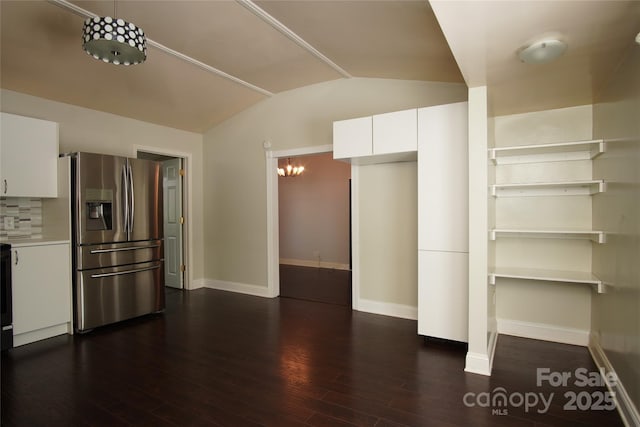 3974 Pleasant Plains Rd, Matthews, NC 28104 - kitchen with lofted ceiling, white cabinetry, dark wood-type flooring, light countertops, and modern cabinets