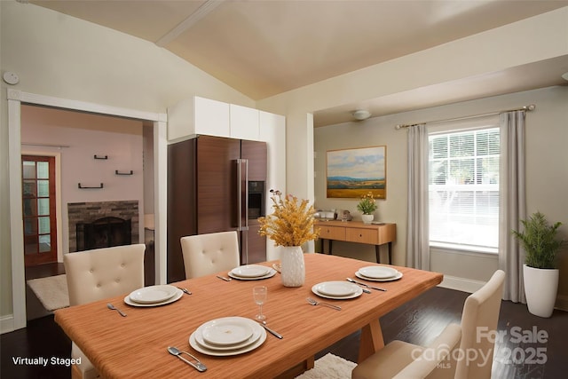 3974 Pleasant Plains Rd, Matthews, NC 28104 - dining area with lofted ceiling, dark wood finished floors, and a stone fireplace