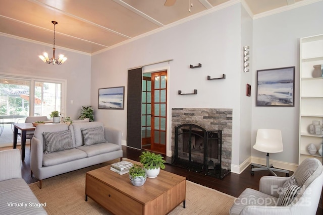 3974 Pleasant Plains Rd, Matthews, NC 28104 - living room with wood finished floors, a fireplace, a chandelier, a ceiling fan, and crown molding